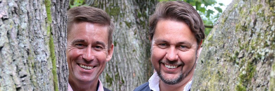 Netcom-sjef August Baumann er svært fornøyd med å få Tele2-sjef Arild Hustads 1,2 millioner kunder i hus. Det gir billigere produksjon av mobiltjenester og dermed mulighet til å konkurrere bedre med Telenor.