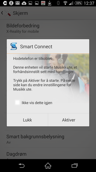 Du kan bestemme hva telefonen skal gjøre når du kobler til ekstrautstyr.