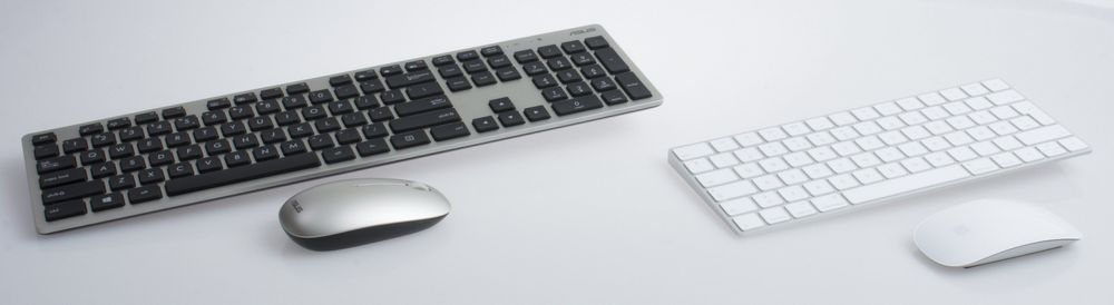 Både Apple og Asus inkluderer tastatur og datamus i sine pakker. Apple i hvitt til høyre.