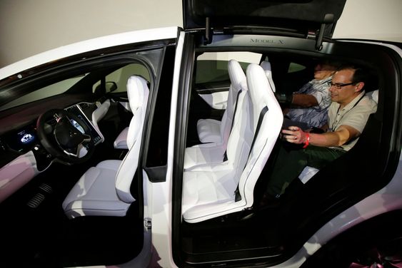 The Tesla Model X car, with a third row of seats, is introduced at the company's headquarters Tuesday, Sept. 29, 2015, in Fremont, Calif. Tesla's Model X ó one of the only all-electric SUVs on the market ó was officially unveiled Tuesday night near the company's California factory. (AP Photo/Marcio Jose Sanchez)