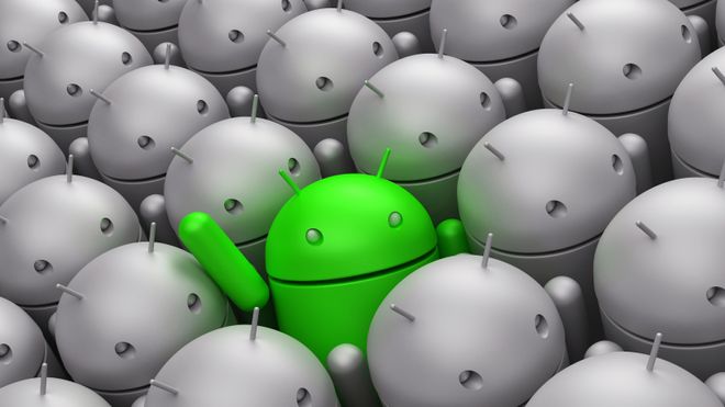Green Android robot in the middle of grey crowd