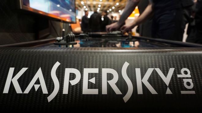 A Kaspersky employee shuffles tokens around a table-top display at the company's stand at a cybersecurity conference in Lille, northern France, Wednesday, Jan. 25, 2017. Kaspersky on Wednesday confirmed that a senior manager at the firm had been arrested in Moscow. (AP Photo/Raphael Satter)