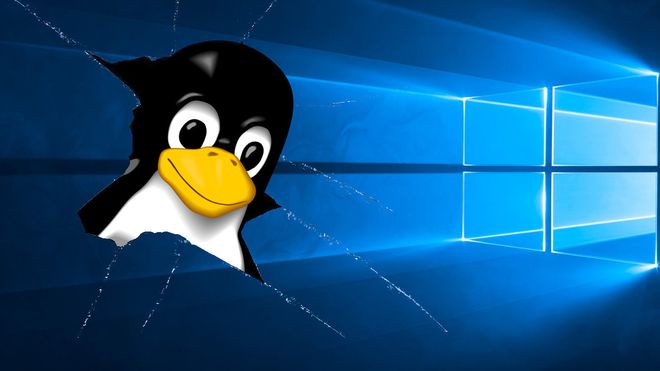 Linux-maskoten Tux som bryter seg gjennom Windows 10.