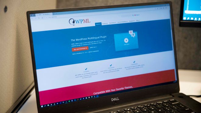 En bærbar PC viser hjemmesiden til WPML.