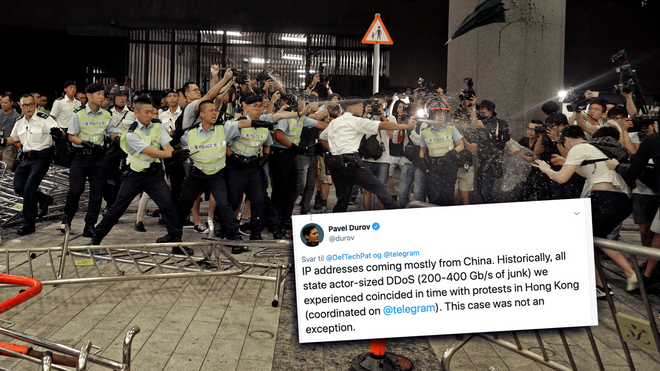 Politifolk i sammenstøt med demonstranter utenfor den lovgivende forsamlingen i Hongkong. Bildet er tatt mandag morgen.
