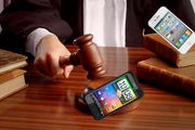 Les HTC taper første runde mot Apple