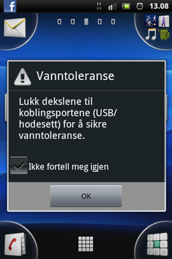 Telefonen minner det på å stenge lukene når du kobler fra hodetelefonene eller USB-kontakten.