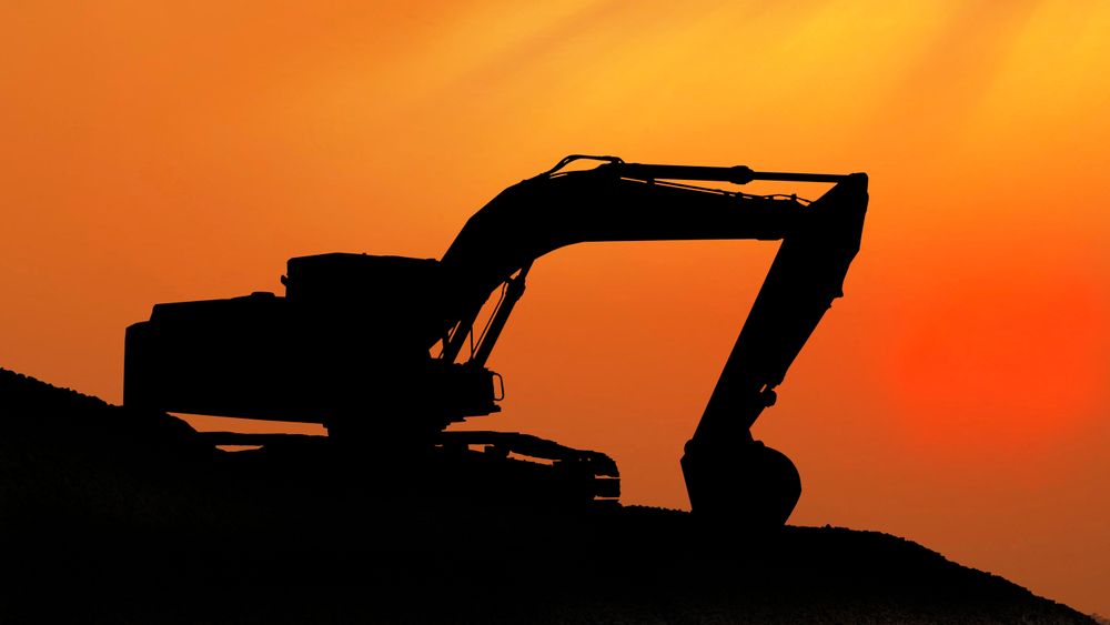 Silhouetted Digging Machine