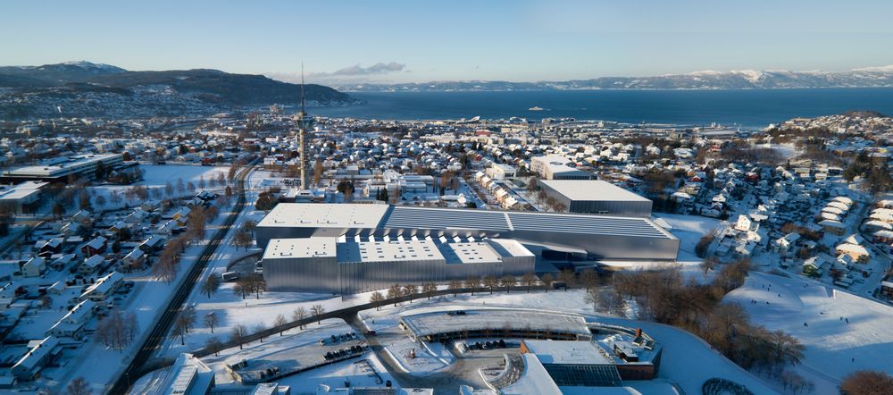 Fugleperspektiv av det nye marintekniske senteret på Tyholt med det kjente tårnet og Trondheimsfjorden i bakgrunnen.