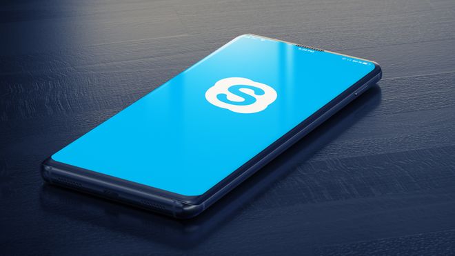telefon med blå skjerm og et Skype Icon 