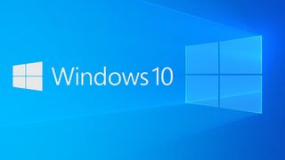Windows 10-logoen på en skrivebordsbakgrunn.