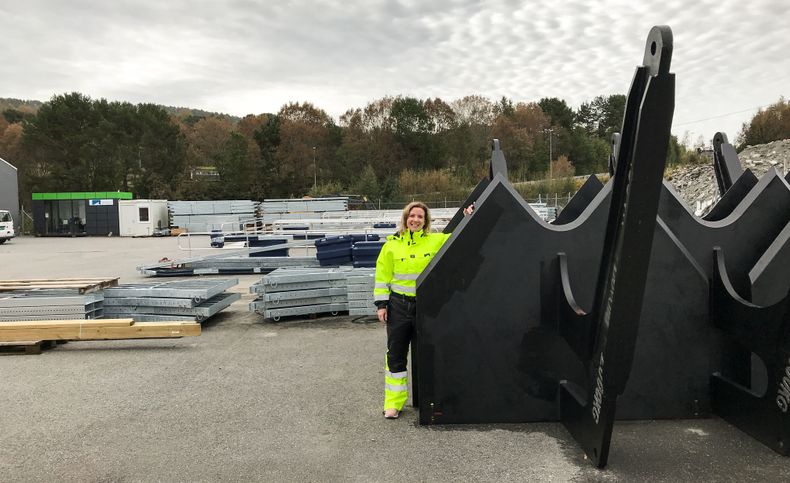 Tone Jøssang Hovdenakk marketing manager at sales company Marina Solutions with a two-ton steel anchor used to anchor structures to the bottom. 